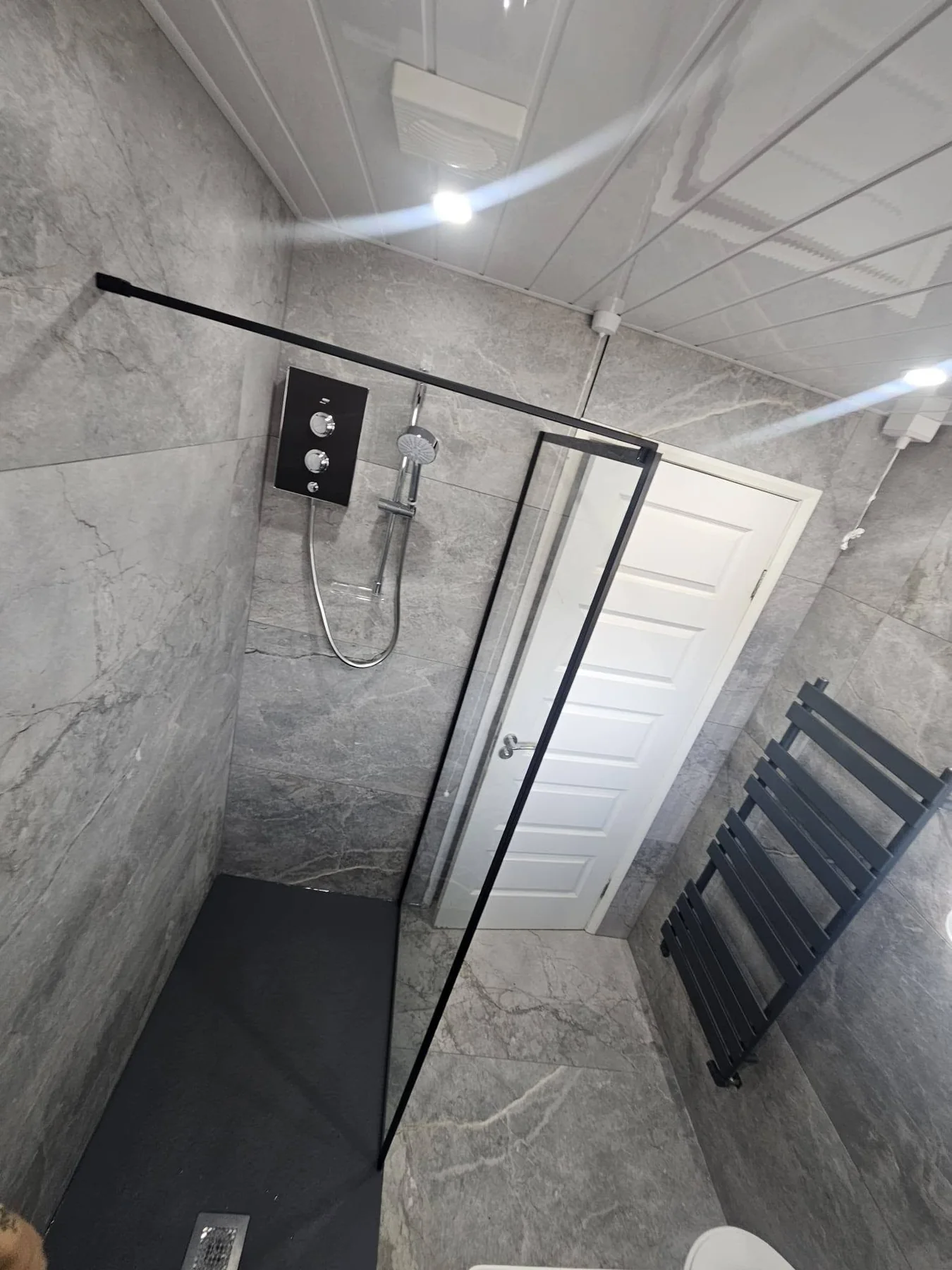 Completed bathroom photograph 2 of Monochrome Stone-Effect Shower Room